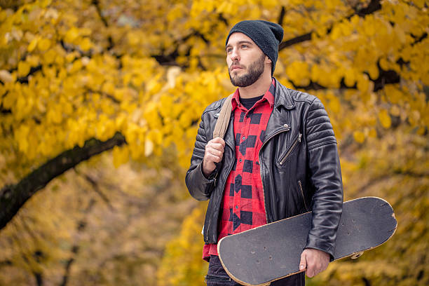 istock Young skateboarder in autumn park 625785126