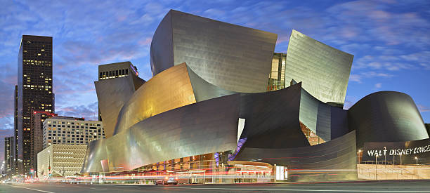 Disney Concert Hall - Grand Avenue - Los Angeles Los Angeles, USA - November 19, 2016: Grand Avenue streetscape with the Walt Disney Concert Hall. Designed by Frank Gehry and opened in 2003, This is one of the four halls of the Los Angeles Music Center and home to the Philharmonic orchestra and the Los Angeles Master Chorale. frank gehry building stock pictures, royalty-free photos & images