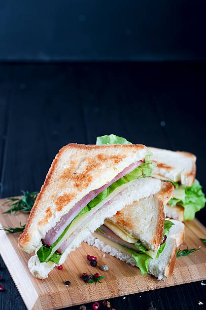 istock club sandwiches on wood background 625793072