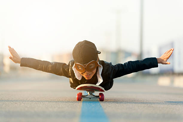 istock Young Boy Imagines Flying On Skateboard 625793876