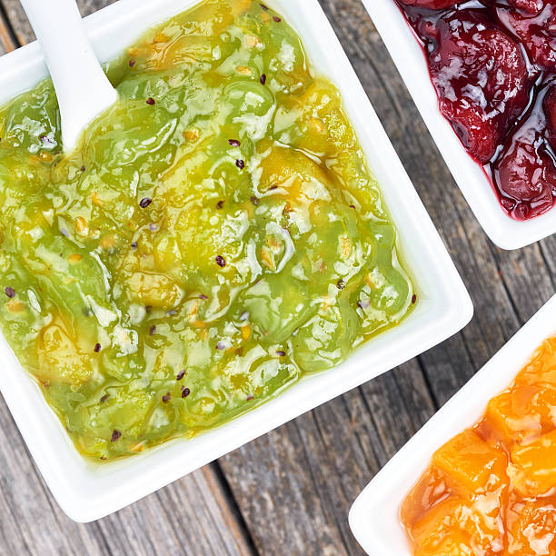 Set of fruit jams in white bowls