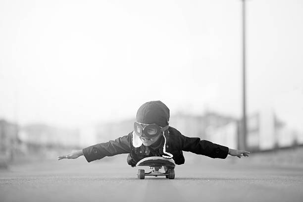 istock Young Boy Imagines Flying On Skateboard 625794744