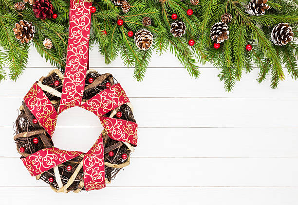 istock Christmas background. Christmas wreath decorated with ribbon. Copy space 625797832