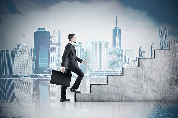 istock Man climbing stairs and cityscape 625798806