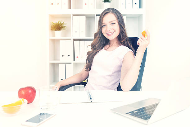 istock Woman with orange and fruit 625799550