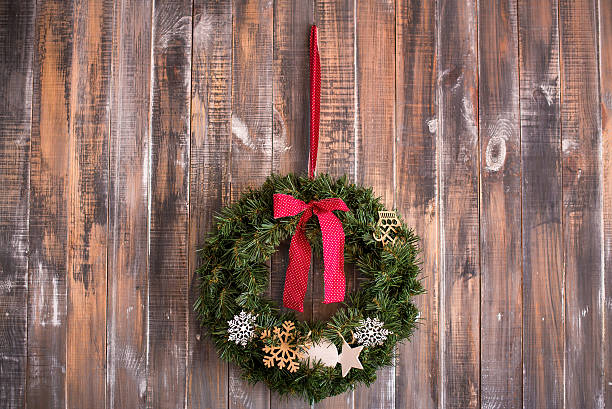 istock Christmas wreath on the wooden background 625800474