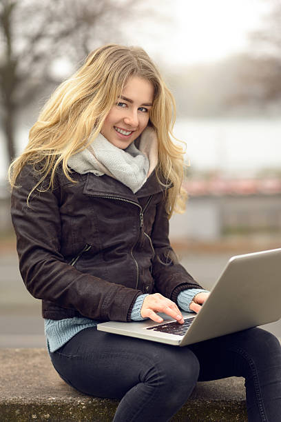 istock Young woman working on her laptop 625800732