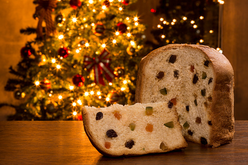 Brazilian panettone, a traditional pastry in Brazilian Christmas with a Christmas lights in the background.
