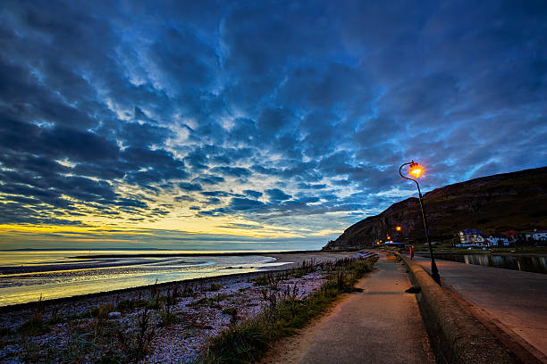 The West Shore beach in Llandudno, North Wales at sunset.