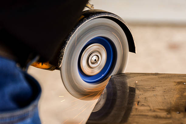 istock Cutting steel with angle grinder at car service 625809608