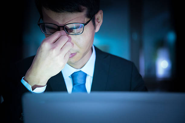 istock Businessman working late in office looking worried 625810064