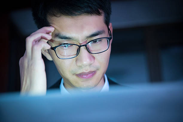 istock Businessman working late in office looking worried 625810122