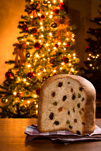Brazilian panettone, a traditional pastry in Brazilian Christmas with a Christmas lights in the background.