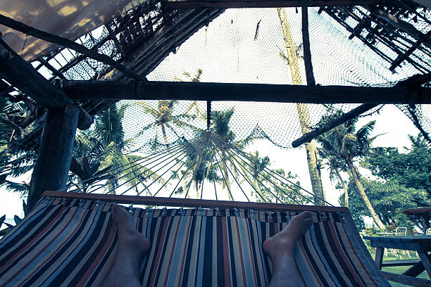 istock Vacation enjoying a hammock,cross processed colors. 625811272