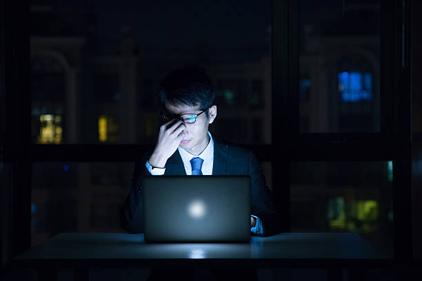 istock Stressed businessman in the office at night 625811328