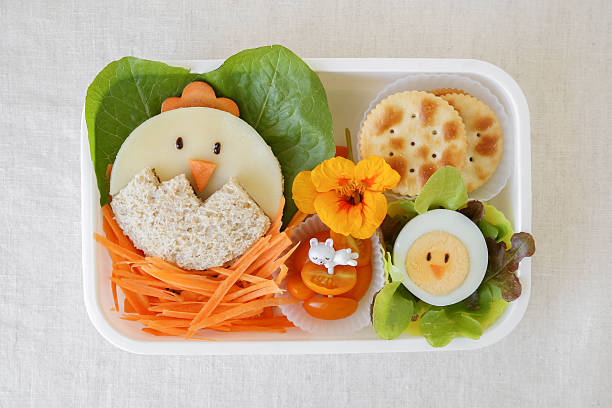 Easter chick lunch box, fun food art for kids Easter chick lunch box, fun food art for kids eating child cracker asia stock pictures, royalty-free photos & images