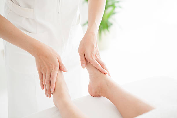 istock The woman is massaged by the ankle 625813488
