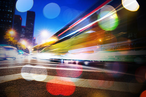 istock Bus Light trails at city night 625813740