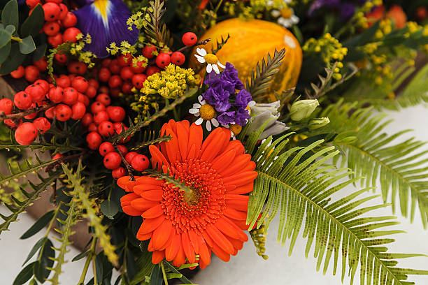 istock Autumn flower box with macaroons on white background 625814812