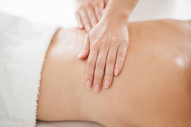 istock Woman having a back massage with an esthetic salon 625828892