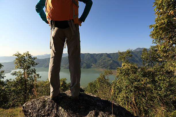 istock successful woman backpacker enjoy the view at mountain peak 625829606