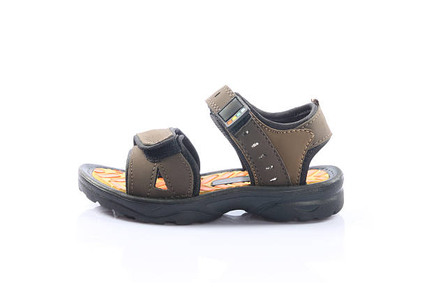 Feet of young thai women in too big sandals