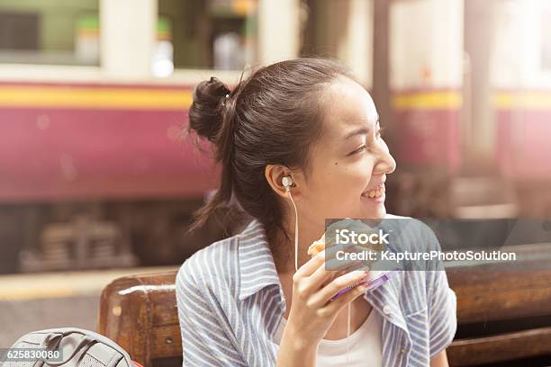 Young Asian Traveler Stock Photo - Download Image Now - Eating, Asian and Indian Ethnicities, Hamburger