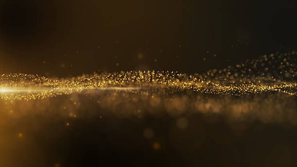 Gold sparkling particles wave background stock photo