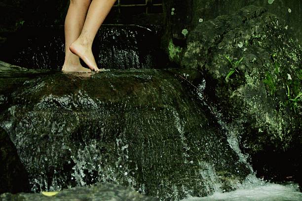 istock Garden waterfall and Girl's leg 625839778