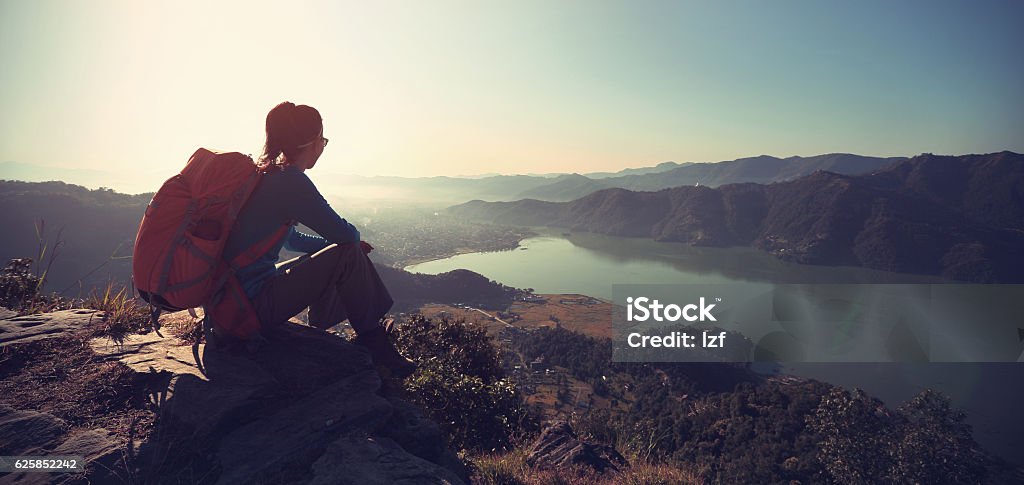 successful woman backpacker enjoy the view at mountain peak Travel Stock Photo