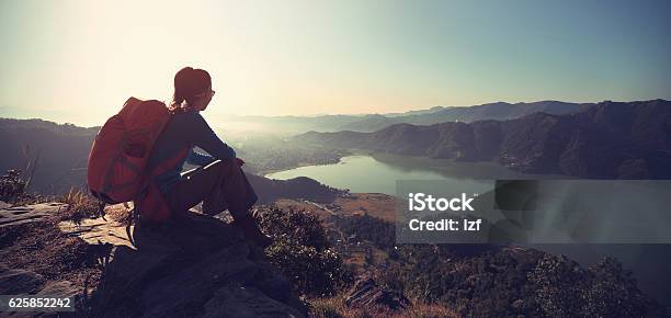 Successful Woman Backpacker Enjoy The View At Mountain Peak Stock Photo - Download Image Now
