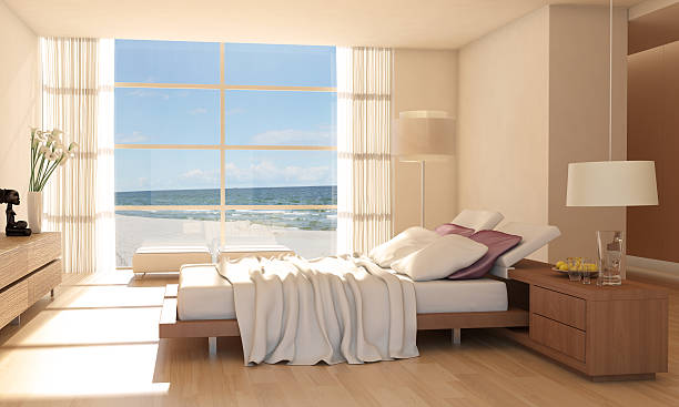 interior minimalista del dormitorio con vistas al mar - apartment architecture contemporary beach fotografías e imágenes de stock
