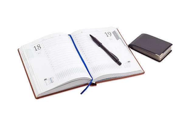 istock Open business diary, pen on it, wallet for business cards 625859814