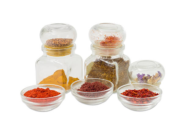 istock Several various spices in small glass bowls and small jars 625860534