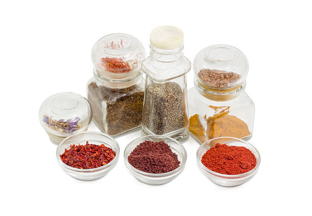 istock Several various spices in small glass bowls and small jars 625860560
