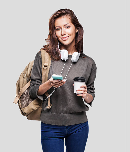 istock Happy young student girl using smart phone 625863600