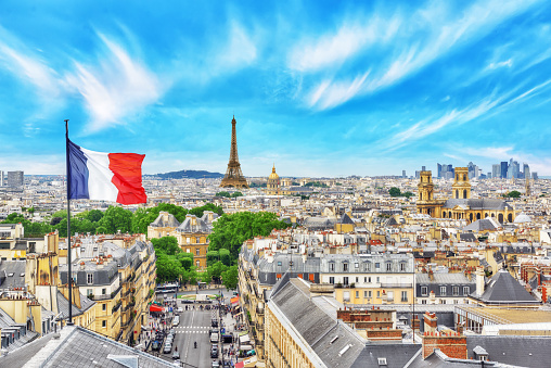 Beautiful panoramic view of Paris from the roof of the Pantheon. View of the Eiffel Tower and flag of France.