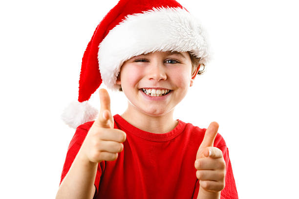 istock Christmas time - boy with Santa Clause hat 625870258