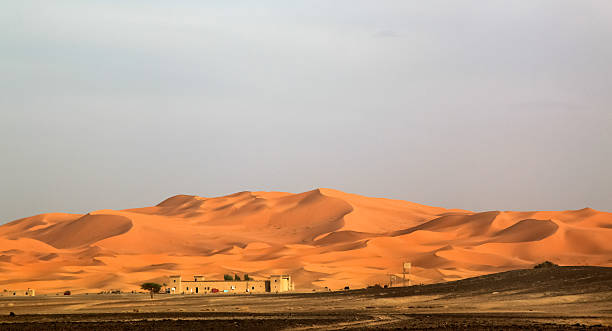 istock Berber homes below stunning sand dunes of Merzouga 625870822