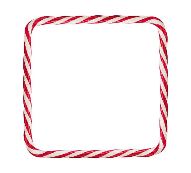 Close up of candy cane frame isolated on white background with copy space