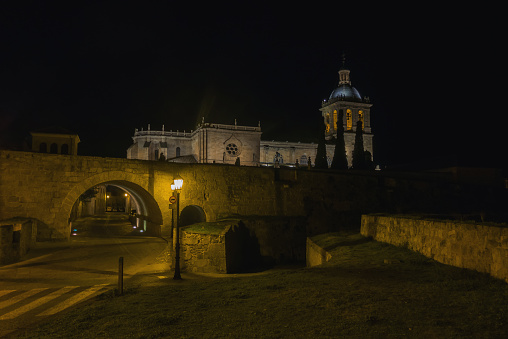 Night view of the entrance of Ciudad Rodrigo and cathedral. Salamanca, Spain