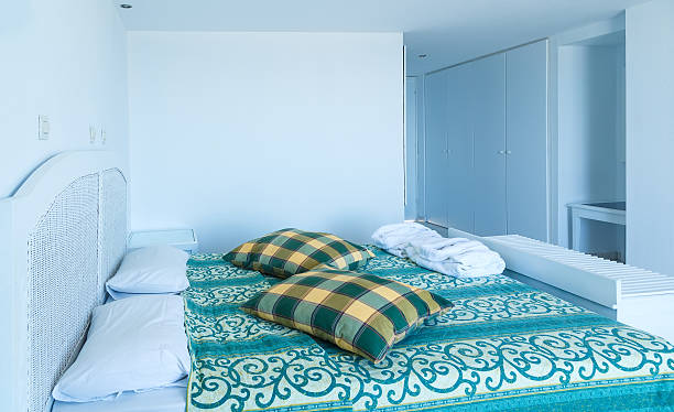 istock Double bed in the modern interior hotel room 625874560