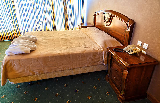 istock double bed in hotel room with vintage design 625874890