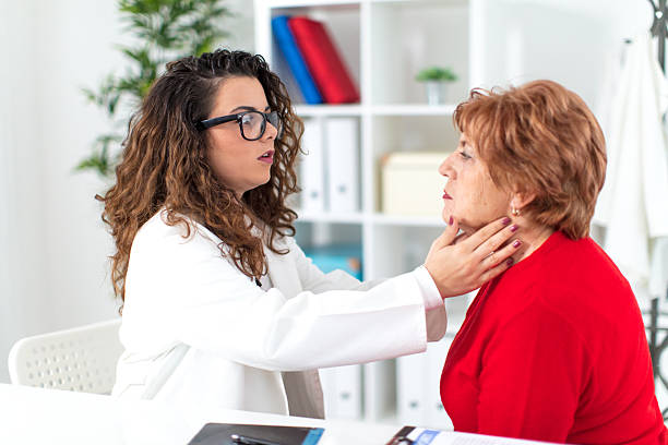 istock Nurse checking pulse to senior woman 625874964