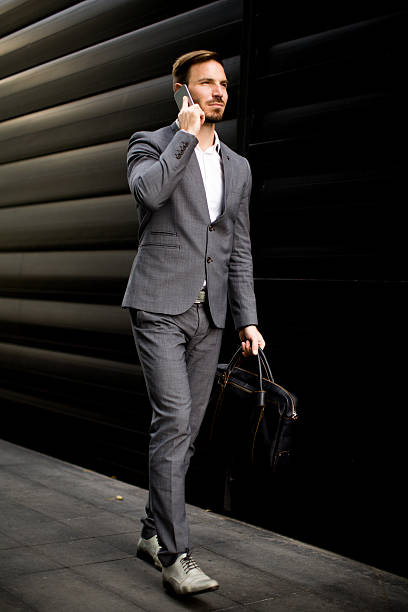 istock Young businessman with mobile phone 625875198