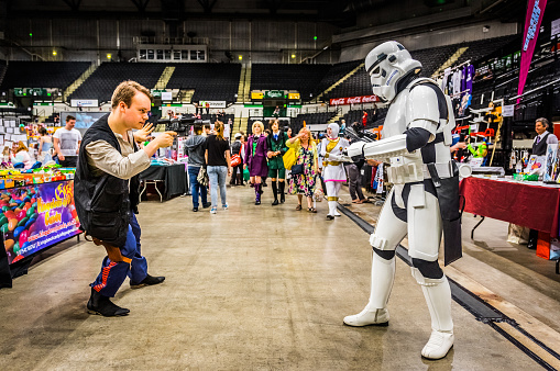 Sheffield, United Kingdom - June 12, 2016: Cosplayers dressed as a 'stormtrooper' and 'Han Solo' from 'Star Wars' having a mock fight at the Yorkshire Cosplay Convention at Sheffield Arena