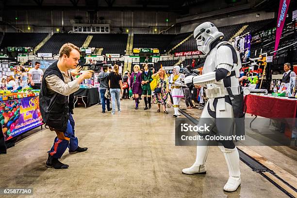 Cosplayers Dressed As A Stormtrooper And Han Solo Stock Photo - Download Image Now