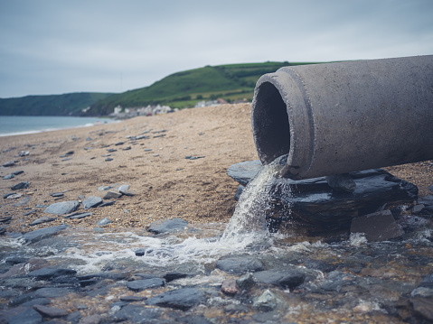 A large sewage pipe on the beach