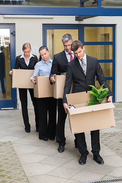 istock Disappointed Businesspeople With Cardboard Boxes 625877916