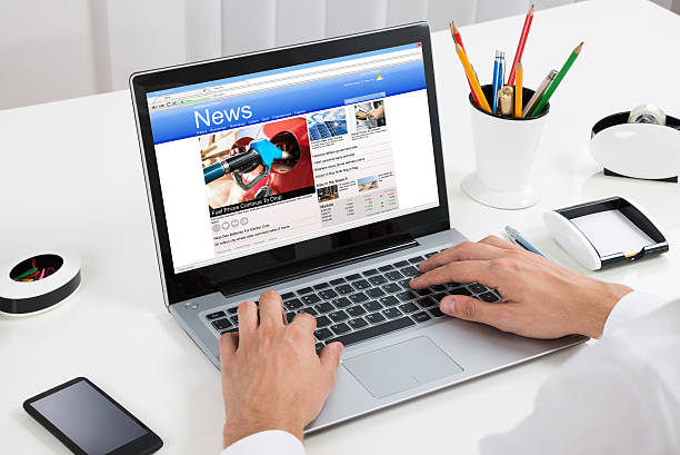 istock Person Reading News On Laptop 625881248